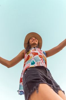 Low angle view of cute three asian women hold hands circle running round camera shot below with sky overhead in concept travel, happy and fun lifestyle, friendship. Pastel vintage style