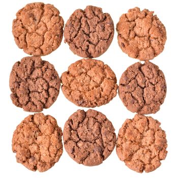 Round muesli cookies with chocolate top view isolated on white background.
