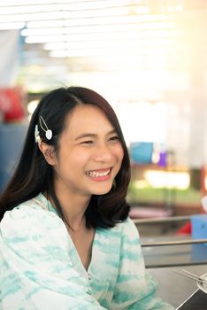 Asian pretty cute woman eating thai food with rice and many food on dining table in restaurant with happy and enjoy emotion