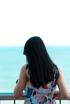 Asian pretty woman relax at sea viewpoint with loneliness and lonely emotion in concept travel, vacation, leisure in life