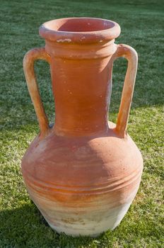An egyptian traditional clay (terracotta) jar on the grass