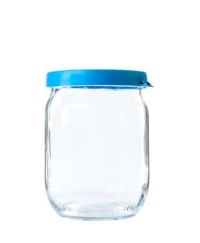 Transparent glass jar on white background, with the closed plastic blue top
