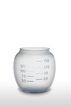 A plastic graduated measurement  glass for laundry on white background