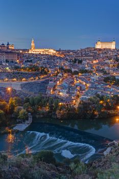 View of Toledo in Spain with the Tagus river at dusk