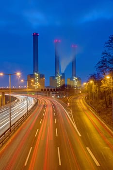 Highway and power station at night seen in Berlin, Germany