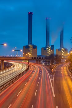 Highway and power station at night seen in Berlin, Germany