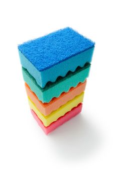 A stack of multicolored kitchen sponges isolated on white background
