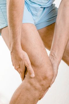 Athlete man feeling pain to the knee. It could be medial meniscus tears, injuries of the collateral ligament, bursitis or Iliotibial band syndrome.