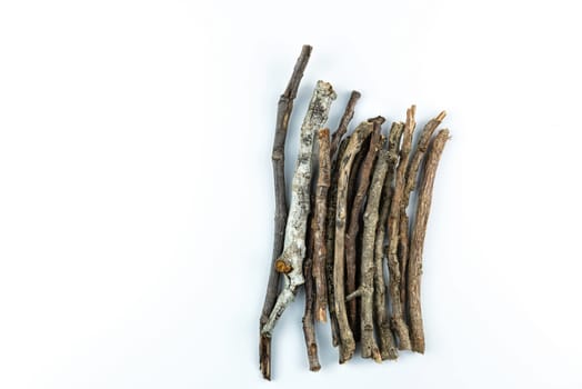 Pile of dry twigs on white background	