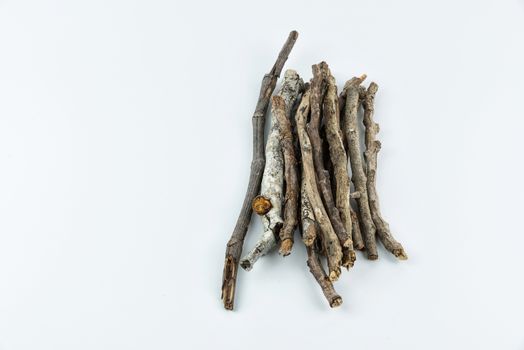 Pile of dry twigs on white background	