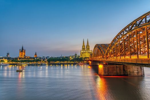 The river Rhine with the famous skyline of Cologne after sunset