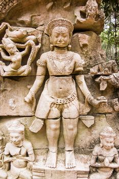 Stone carving of a hindu god. Ruins of Ta Prohm temple, Angkor, Cambodia.
