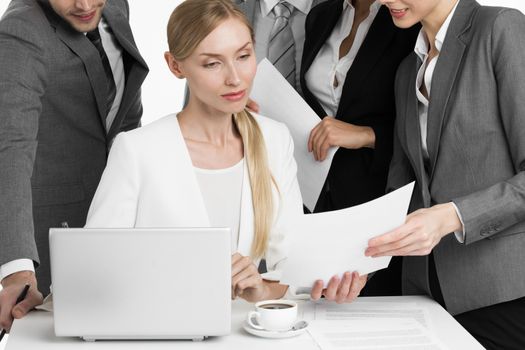 Business people working in office. Smiling business men handing over documents to businesswoman