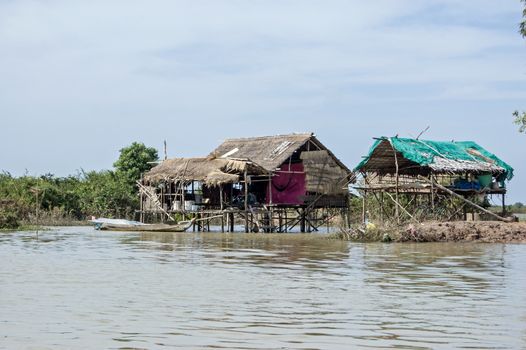 Two homes on stilts in the village of Kompong Phluk on the shores of Tonle Sap Lake near Siem Reap, Cambodia.