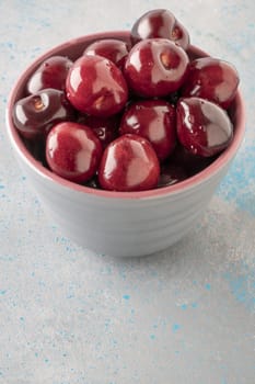 closeup fresh ripe cherry fruits in a bowl on table with copy space