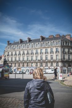 Nantes, France - September 25, 2018: Woman walking Nantes cathedral square one at the end of summer