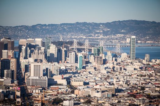 San Francisco, USA - February 14 - The Downtown area of San Francisco from Twin Peaks at sunset. The Bay Bridge to Oakland lies in the background on February 14th 2013.