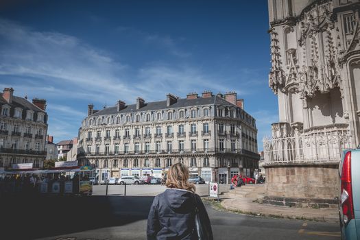 Nantes, France - September 25, 2018: Woman walking Nantes cathedral square one at the end of summer