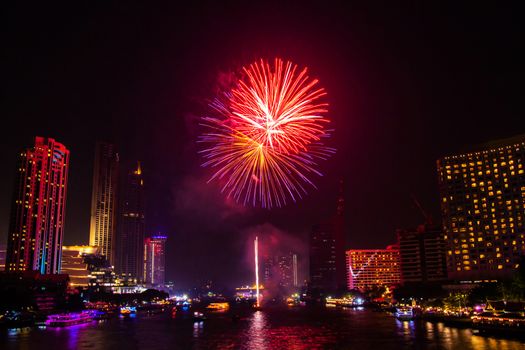 Firework colorful on night city view background for celebration festival.