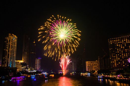 Firework colorful on night city view background for celebration festival.