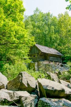 A typical ukrainian antique stone house in the forest, in Pirogovo near Kiev