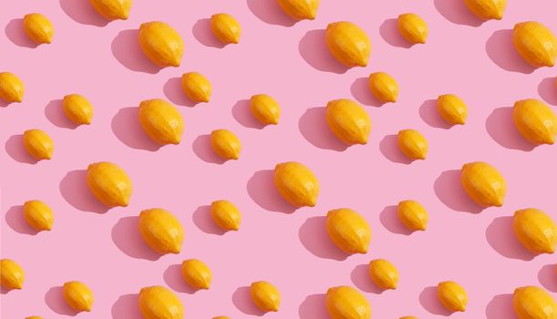 Trendy isometric Seamless continuous pattern of yellow lemons on pink background. Minimalist concept of fresh citrus fruit