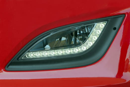 LED Headlight detail of a white modern car