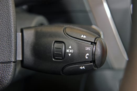 Detail of a luxury car interior, audio control