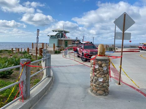 CClosed beach of La Jolla with informative signage during COVID-19 pandemic. Coronavirus virus panic and quarantine San Diego, USA, April 18th, 2020