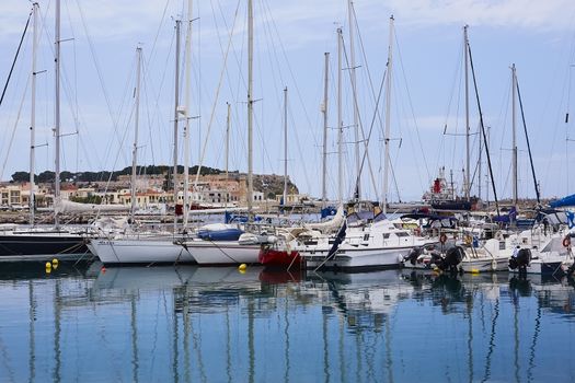 RETHYMNO, THE CRETE ISLAND, GREECE - MAY 30, 2019: Beautiful big white yachts in the seaport of the Rethymno, the Crete island, Greece