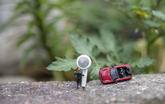 man asks for help through emergency service after a car accident with his red convertible