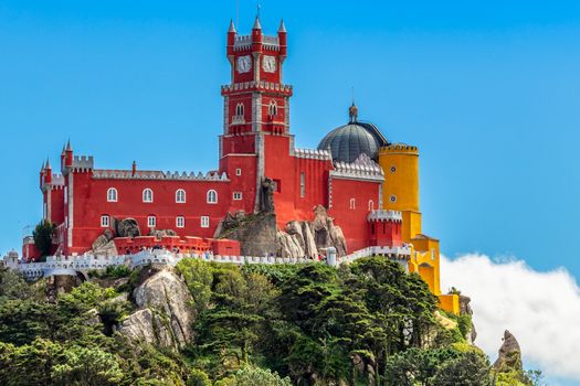 The red and yellow walls and towers of Pena Palace, Sao Pedro de Penaferrim, Sintra, Portugal