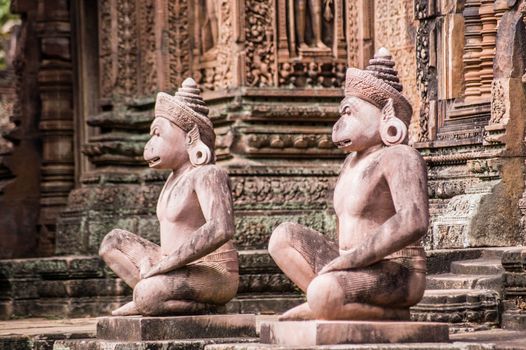 A pair of Monkey headed guardians at the front of a prasat, or chapel, at Banteay Srei Temple, Angkor, Cambodia. Over 1000 years old.