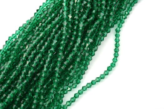 Beautiful Light green Glass Sparkle Crystal Isoalted Beads on white background. Use for diy beaded jewelry