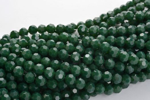 Beautiful Light green Glass Sparkle Crystal Isoalted Beads on white background. Use for diy beaded jewelry