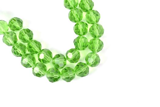 Beautiful Light green Glass Sparkle Crystal Isoalted Beads on white background. Use for diy beaded jewelry