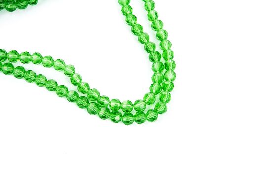 Beautiful Light green Glass Sparkle Crystal Isoalted Beads on white background. Use for diy beaded jewelry