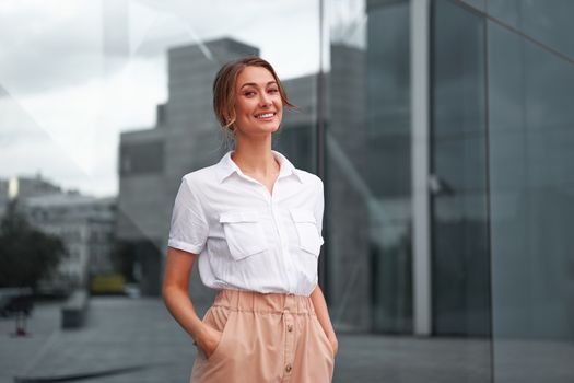 Businesswoman successful woman business person standing outdoor corporate building exterior Smile happy caucasian confidence professional business woman middle age female entrepreneur Bank employee