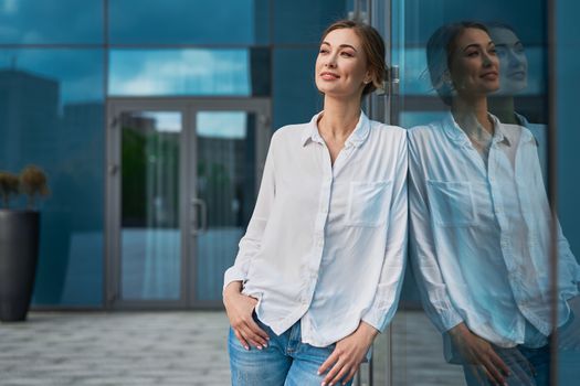 Businesswoman successful woman business person standing outdoor corporate building exterior Pensive elegance cute caucasian confidence professional business woman middle age female leader Bank worker