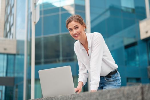 Businesswoman laptop successful woman business person outdoor corporate building exterior Pensive elegance caucasian professional business woman middle age ecommerce deal Online banking
