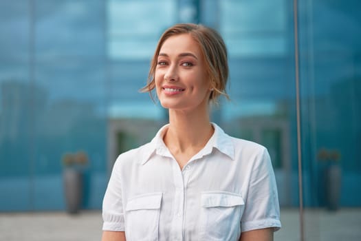 Businesswoman successful woman business person standing outdoor corporate building exterior Smile happy caucasian confidence professional business woman middle age female entrepreneur Bank employee