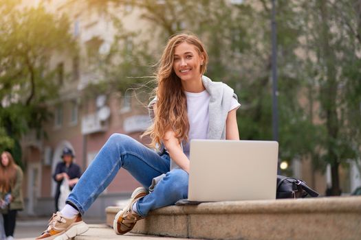 Businesswoman laptop successful woman business person outdoor corporate building exterior Pensive elegance caucasian professional business woman middle age ecommerce deal Online banking Sitting ground