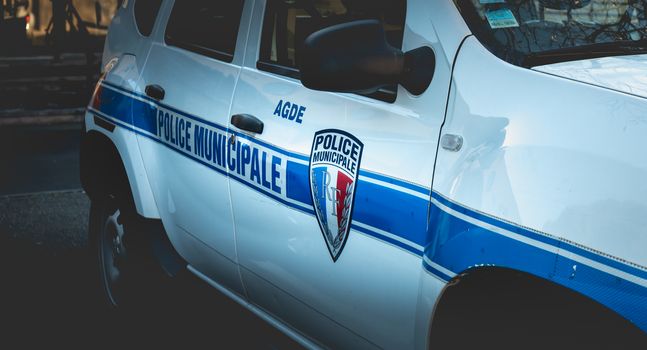 Agde, France - January 1, 2019: closeup on a car of the municipal police of Agde on a winter day parked in the city center