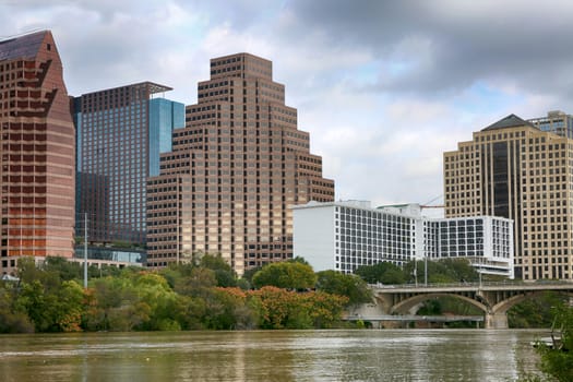 Austin, Texas: A downtown skyline on the Colorado River. Austin is the capital of the U.S. state of Texas and "world capital of life music".