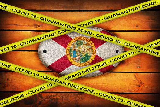 COVID-19 warning yellow ribbon written with: Quarantine zone Cover 19 on Florida flag illustration. Coronavirus danger area, quarantined country.