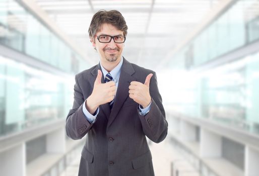 happy business man going thumb up, at the office