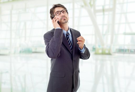 happy business man on the phone, at the office