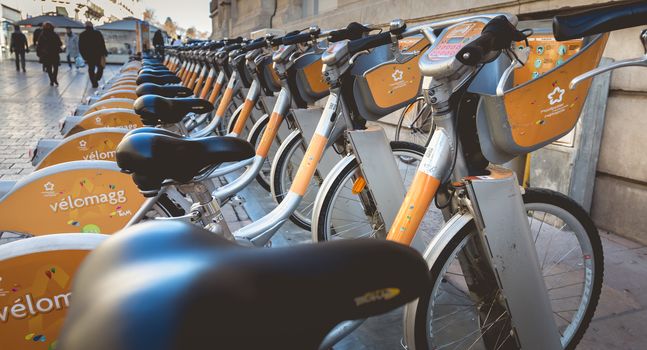 Montpellier, France - January 2, 2019: Velomagg bike sharing city bikes for rental in Montpellier. Bike sharing is a popular city transport