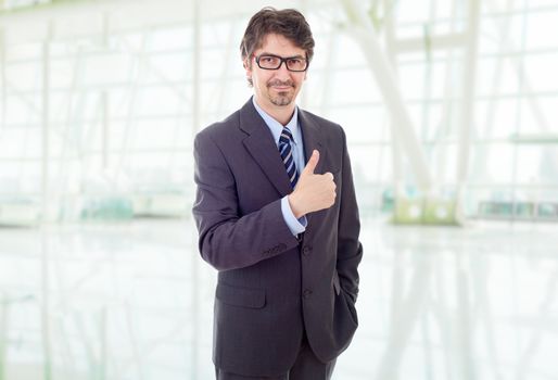 young business man going thumb up, at the office