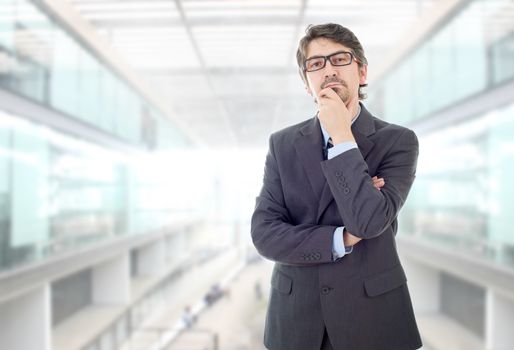 young business man thinking, at the office